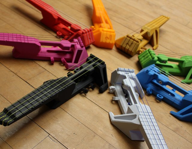 Juan-Carlos-Noguera-3D-printed-Nuke-ukelele-in-various-colors.jpg