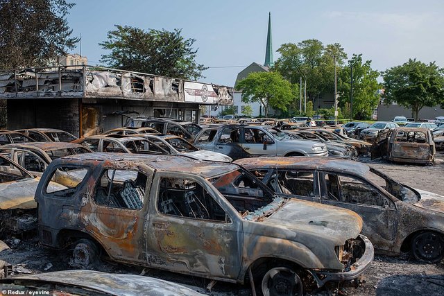 destroyed car dealership and cars