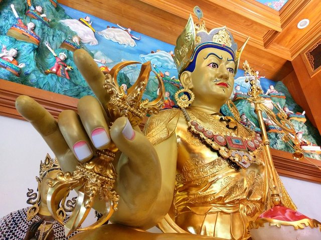 Padmasambhava Performs Kāraṇa Mudrā Holding Vájra