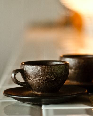 two-espresso-cups-with-saucers-coffee-grounds.jpg