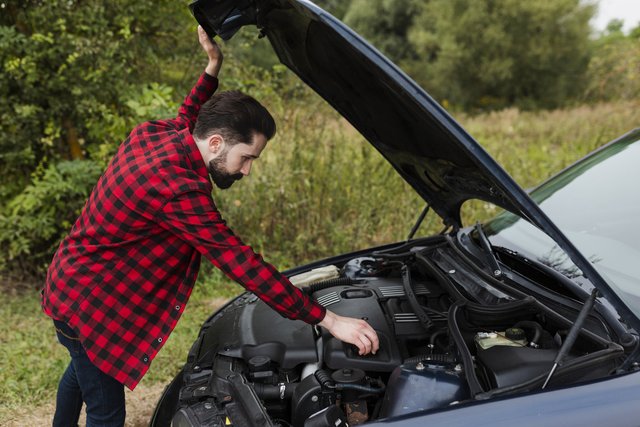 side-view-man-checking-engine-1.jpg