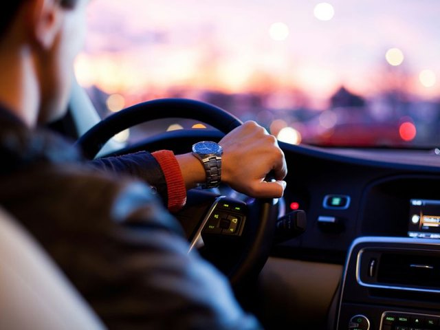 man driving a company car in the netherlands