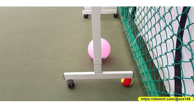 Tennis ball under the white board