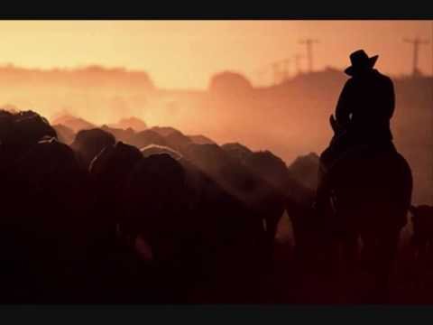 Cowboy In Sunset