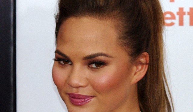 Teigen suffers wardrobe malfunction due to daughter