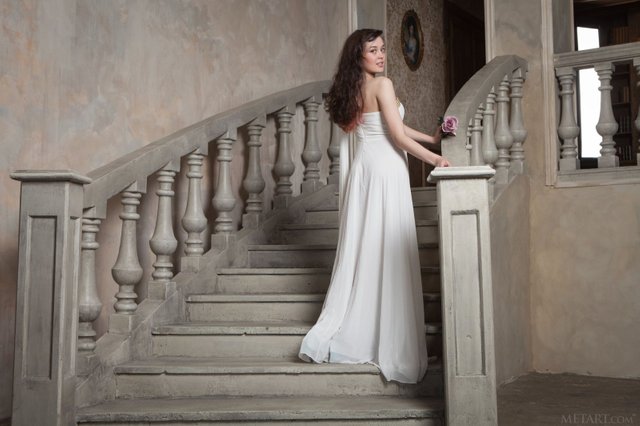 tempting_brunette_in_beautiful_white_dress_showcasing_her_hairy_pussy_on_the_sofa_01