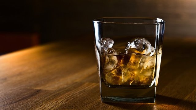 an alcoholic drink in a glass