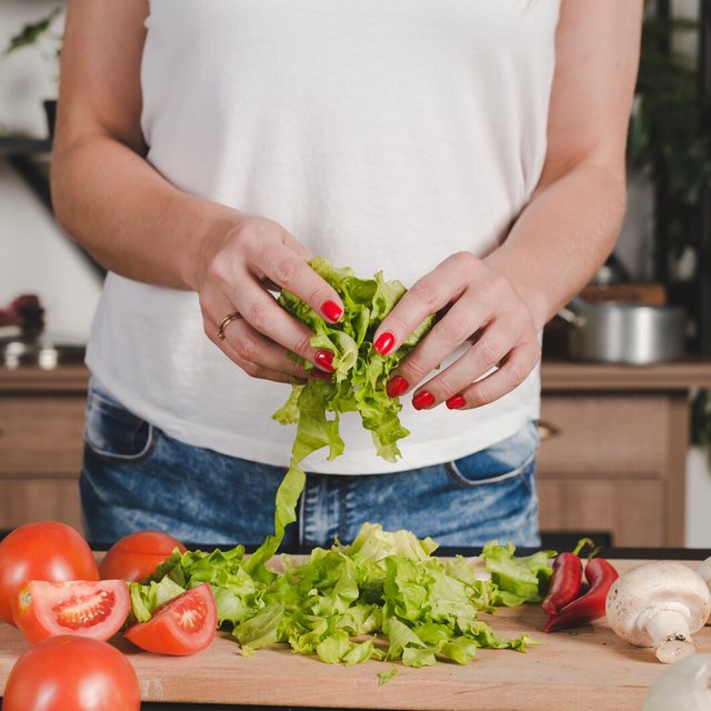 close-up-woman-s-hand-holding-lettuce-hands_23-2147917777.jpg