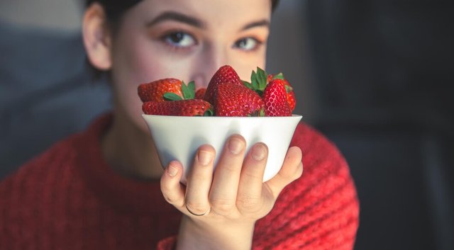 young-woman-holds-bowl-strawberries-her-hands_169016-19734.jpg