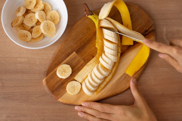 top-view-cut-banana-wooden-board_23-2150241119.jpg