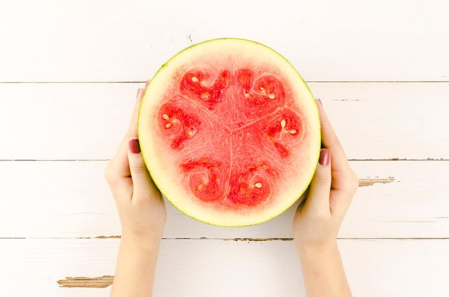 person-holding-half-fresh-watermelon_23-2148100687.jpg