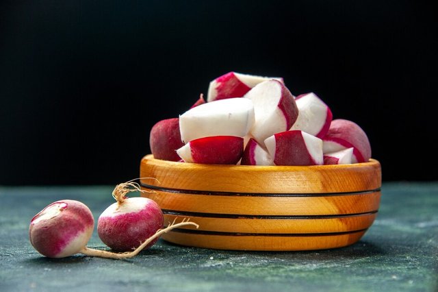 front-view-whole-chopped-fresh-radishes-inside-outside-wooden-bowl-dark-color-background-with-free-space_179666-19945.jpg