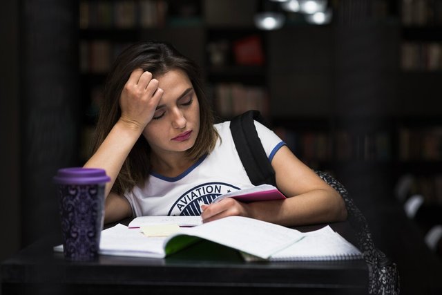 girl-sitting-table-with-notebooks-reading_23-2147657238.jpg