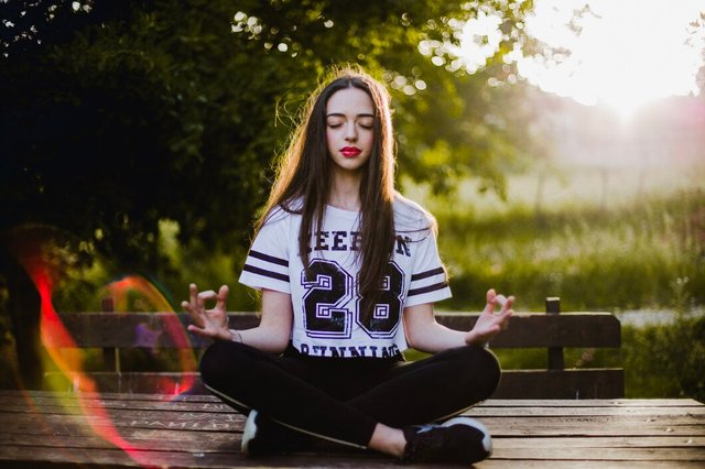 woman-meditating-table-park_23-2147648590.jpg