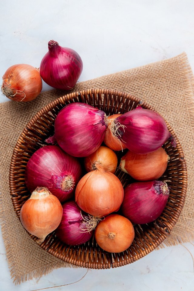 top-view-basket-full-onions-sackcloth-white-background_141793-5887 (1).jpg