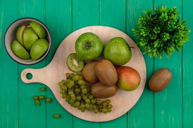 top-view-green-apples-with-kiwi-green-grapes-pear-stand-green-background_141793-51515.jpg