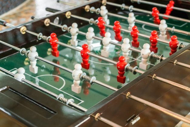 Free photo football table game with red and white player .