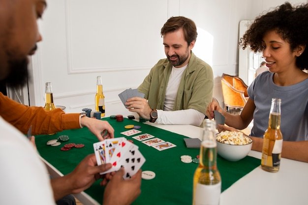 Free photo friends playing poker together