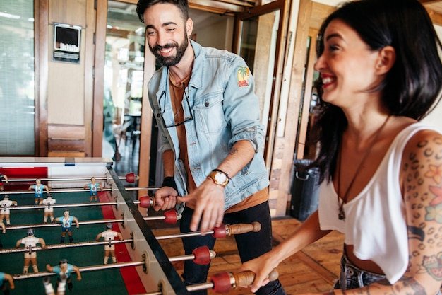 Free photo friends playing table football