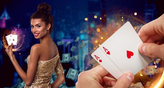 Photo hands of unknown guy holding two aces. smiling mulatto woman showing playing cards while posing against colorful background with flying dollars and sparkling golden lights. poker, casino. close-up