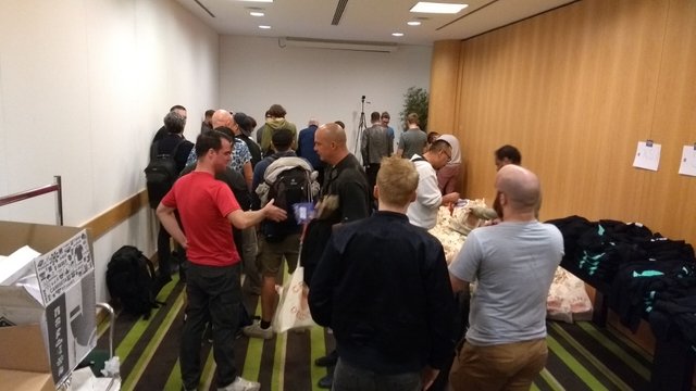 Registration at SF2, Lisbon, 2017. I’m in the red t-shirt having just been sung to in the queue by a German bloke and I’m offering to shake his hand. Pic by @steevc I believe (before I met him)