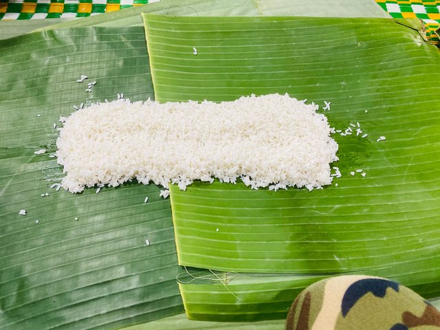 Spread out two small bowls of uncooked white rice. 