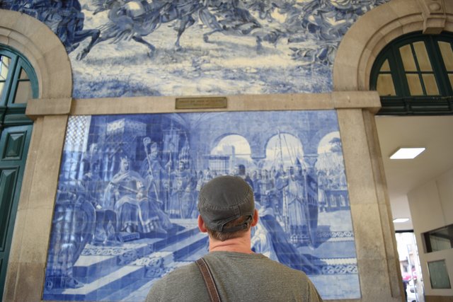 Appreciating the murals at São Bento railway station