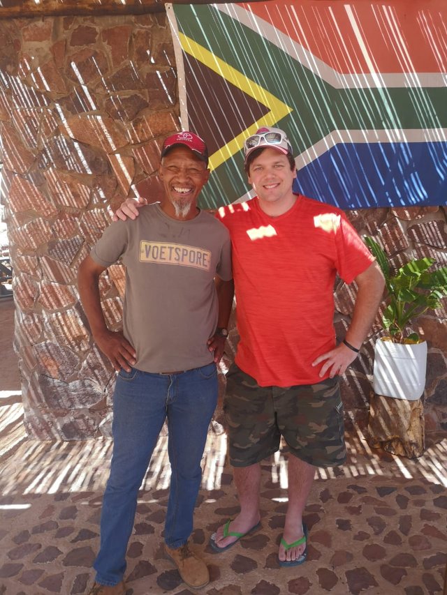 Norbert (left) and Myself (right), outside his little cafe.