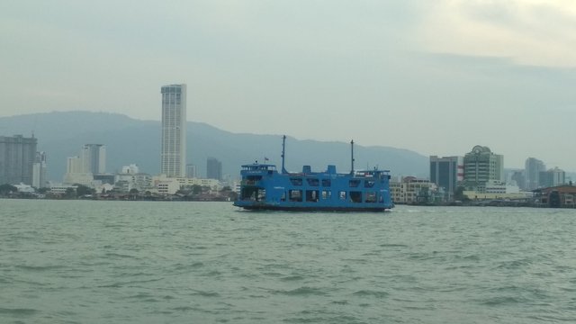 Another blue ferry passing by