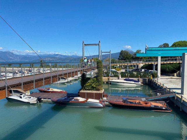 The suspended pedestrian walkway passes directly over this nice marina