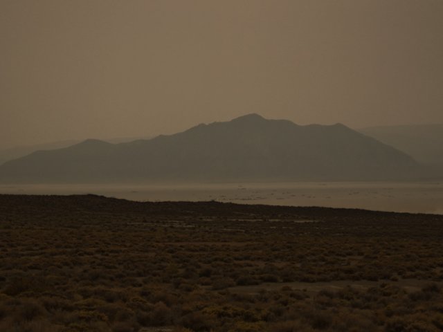 Heavy smoke from the forest fires in California has settled on Black Rock City. Old Sawtooth Mountain in the background.