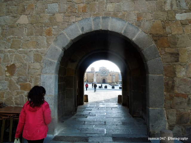 In the background, the Romanesque church of San Pedro