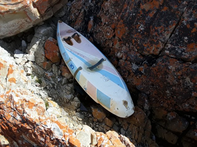 A paddle ski that I found lying here on the remote rocky shoreline