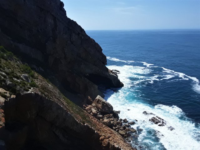 There is no way down at this particular part of the cliff side, which leaves the cavern way below out of reach...for now.