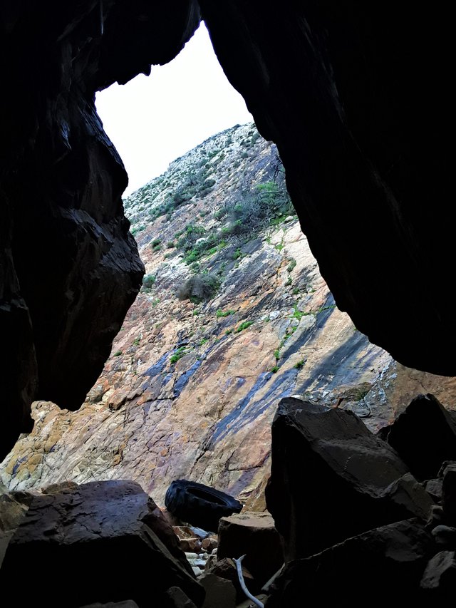 One of my favorite meditation caves, where I spent many hours over the years...with its own tractor tire washed up presumably a long time ago