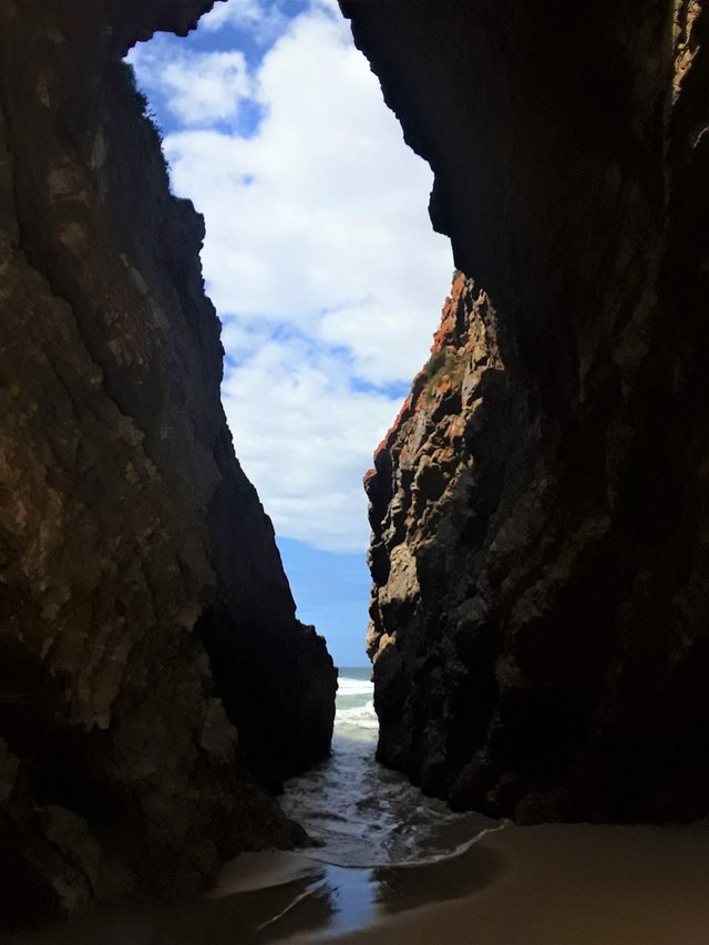 Under the Arch, with tide washing in