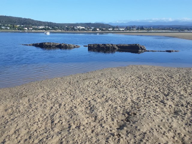 You can see all the holes in the sand, in which the shrimp and other sea creatures hide - now exposed at low tide