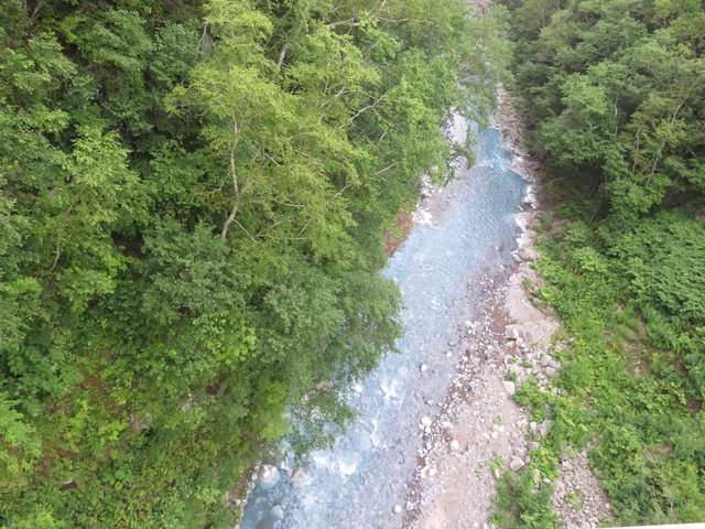 The blue looking river, thanks to the water taking up natural minerals rather than human pollution for a nice change.