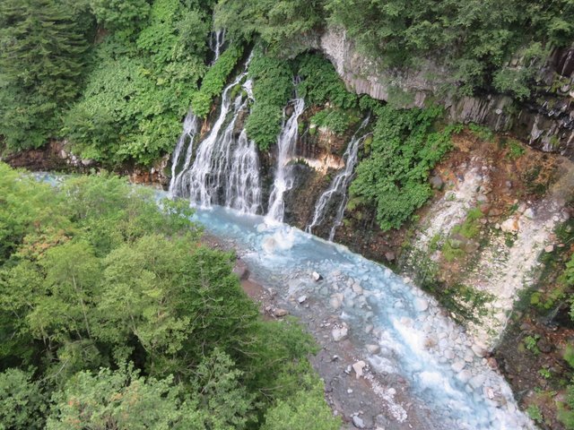 The fantastically beautiful waterfall, there’s a footbridge over the river for easy access to photos.