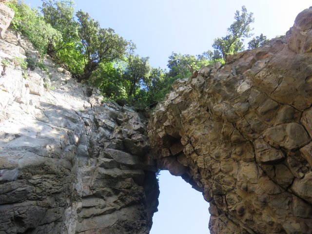 Looking up at the tenuous apex of the tunnel mouth.