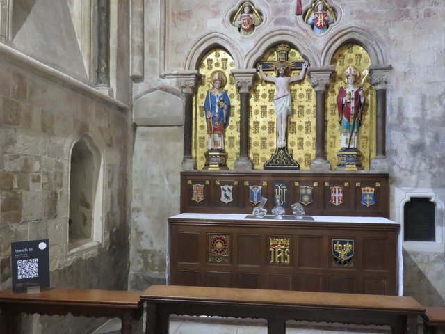 A lovely chapel with three melted lumps of glass and a QR code telling you about them. Who cares!