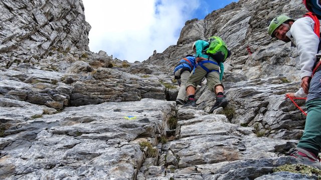 Only the guide smiles (right)