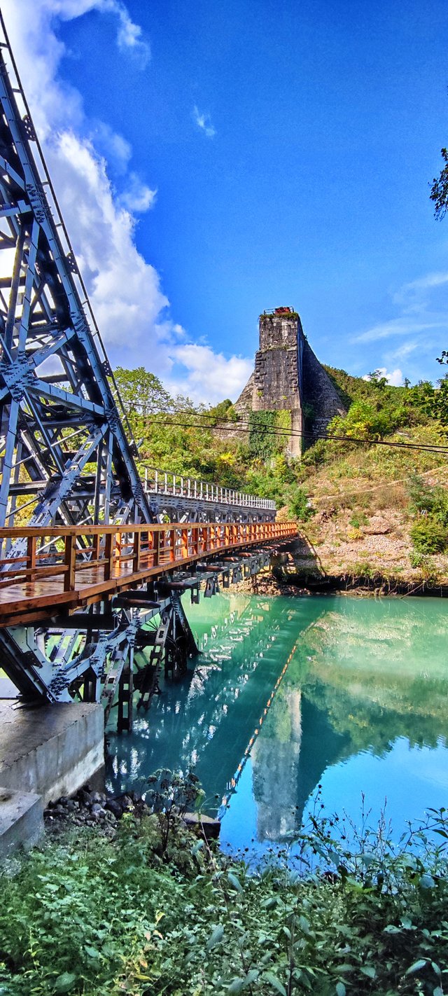 The concrete tower on the right bank is ancient