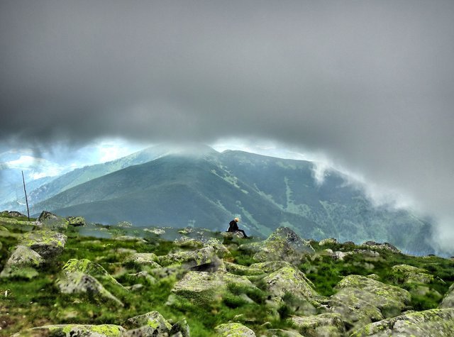 Boy under clouds