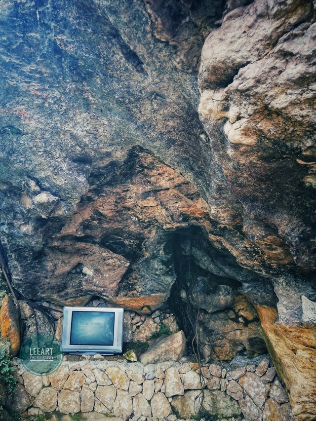 I’m curious as to why an old TV was placed there. When you look at the rocks, there are so many faces and figures that can be formed. The more you look, the more you’ll see. Just let your eyes and your mind relax. Maybe the TV is connected with those.