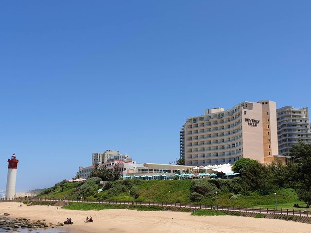 Beverley Hills and Oyster Box Hotel above the lighthouse and Whalebone pier.