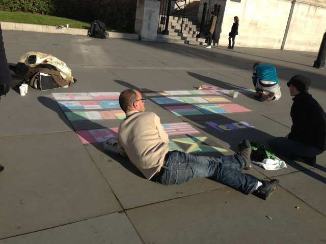 People Painting Flag of Few Countries with Removable Paint on the Street!