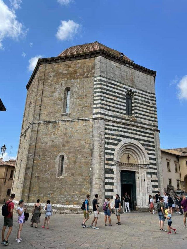 The baptistery typical with the black and white lines in marble.