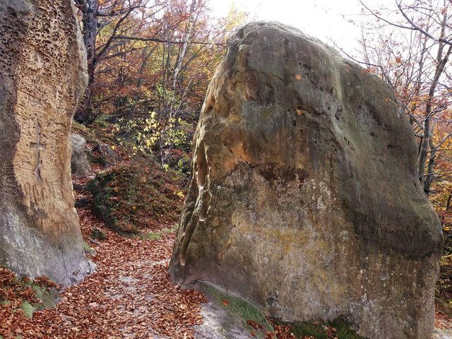 Stone gate on the side of the forest in a cave monastery in the village of Razgirche