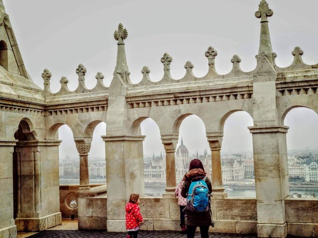 Tourists on the viewing terrace enjoy the view of Budapest from above